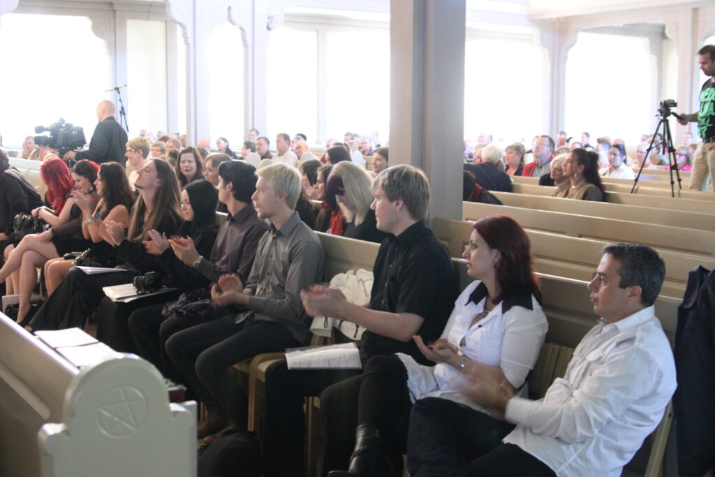 Group of people siting in church 