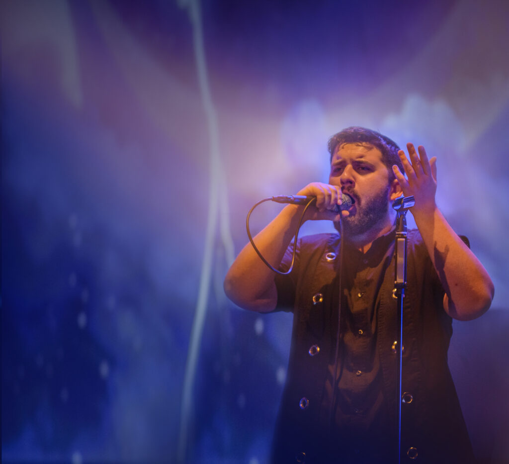 Singer is performing on stage 